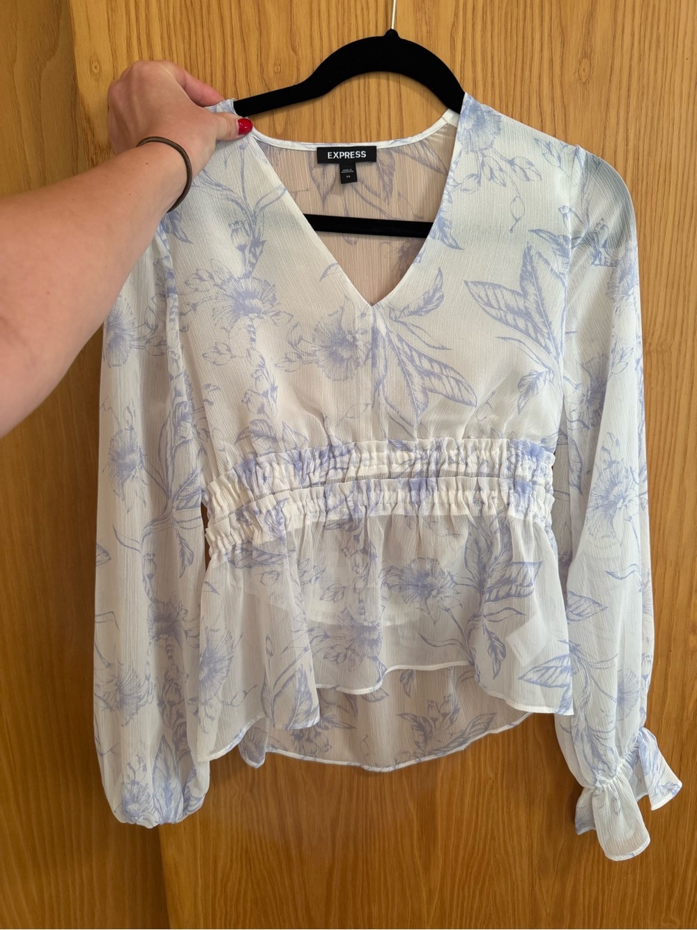 Express size xs Floral V-Neck Long Sleeve Peplum Top in Light Blue